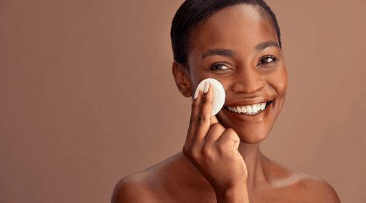 A woman applying acidic toner on her face