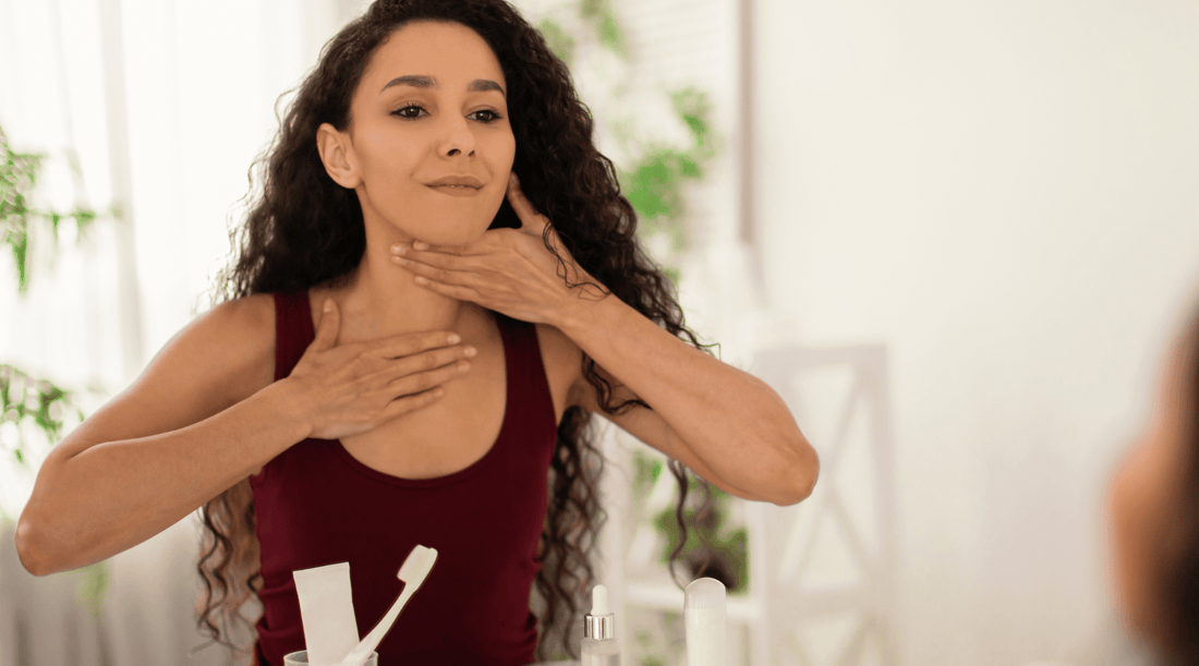 A woman performing lymphatic drainage for face