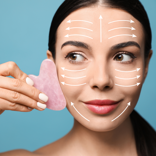 A woman with rose quartz gua sha tool