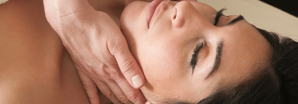 A woman getting a relaxing face massage