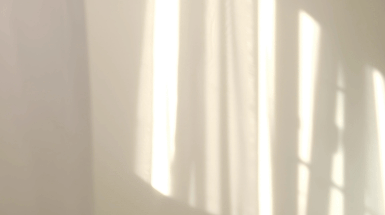 Morning sun reflections on white curtains