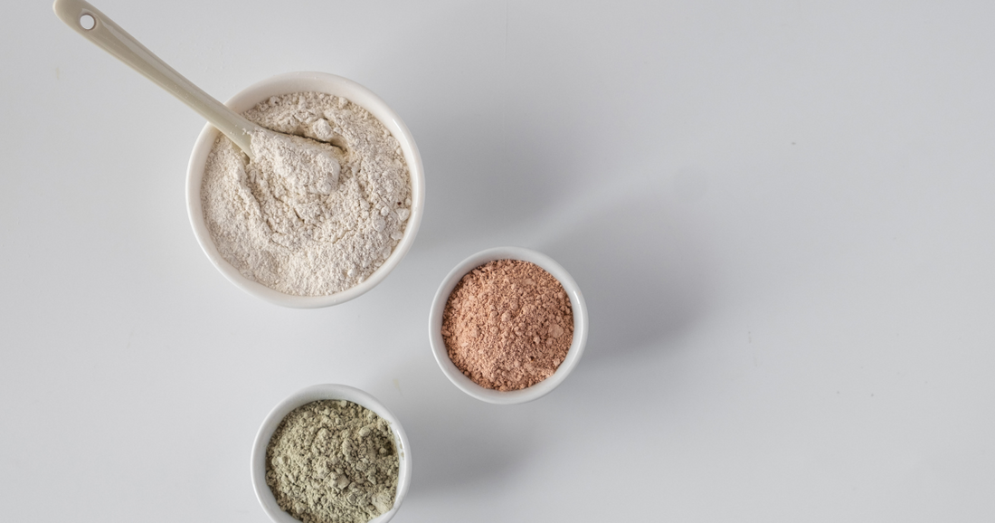 Three different clay powders in bowls