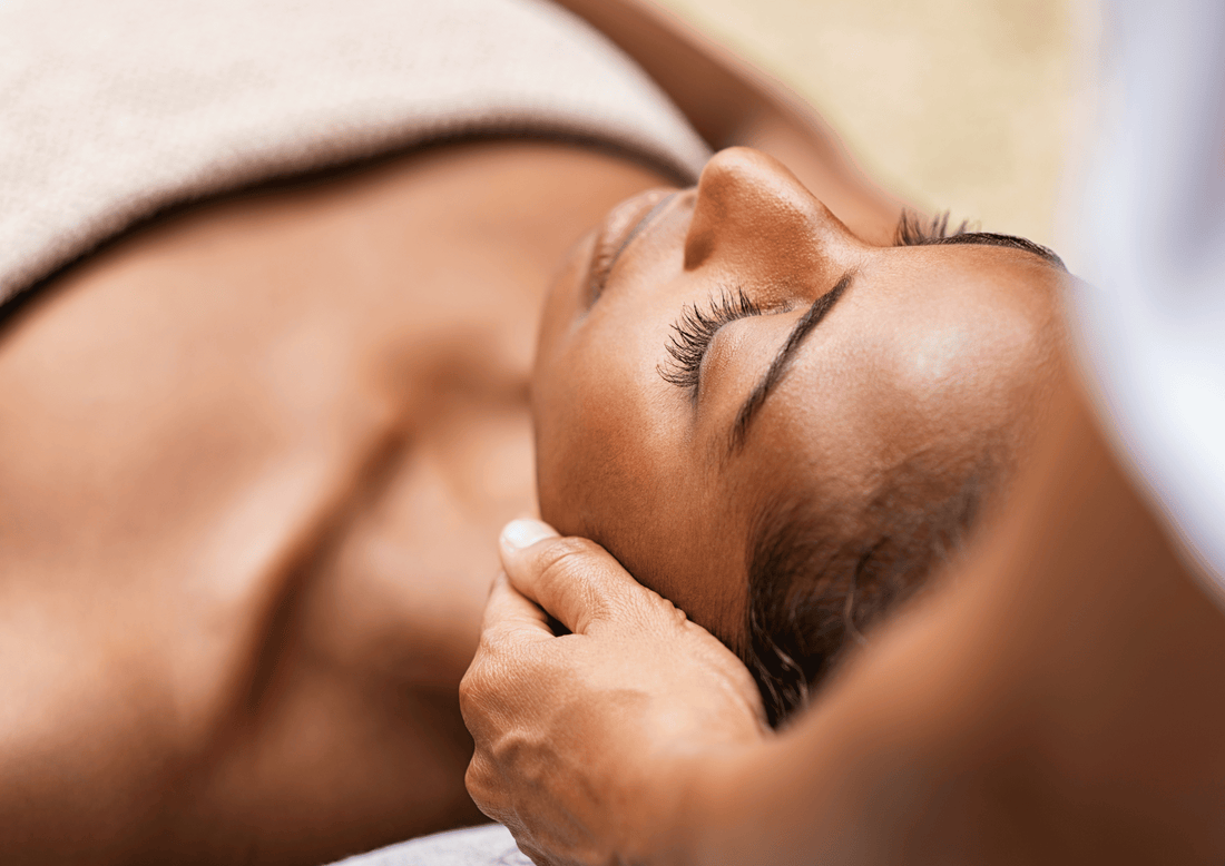 a woman getting a face massage