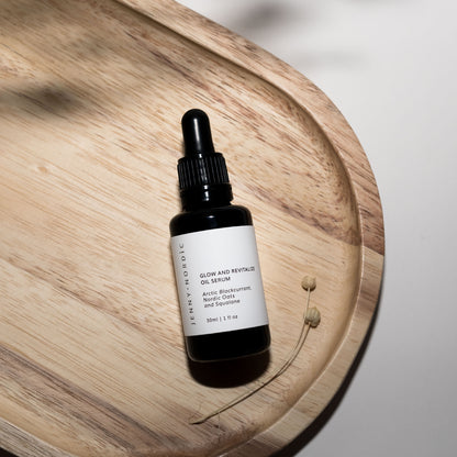 Glow & Revitalize Oil Serum on a wooden tray | Jenny Nordic Skincare